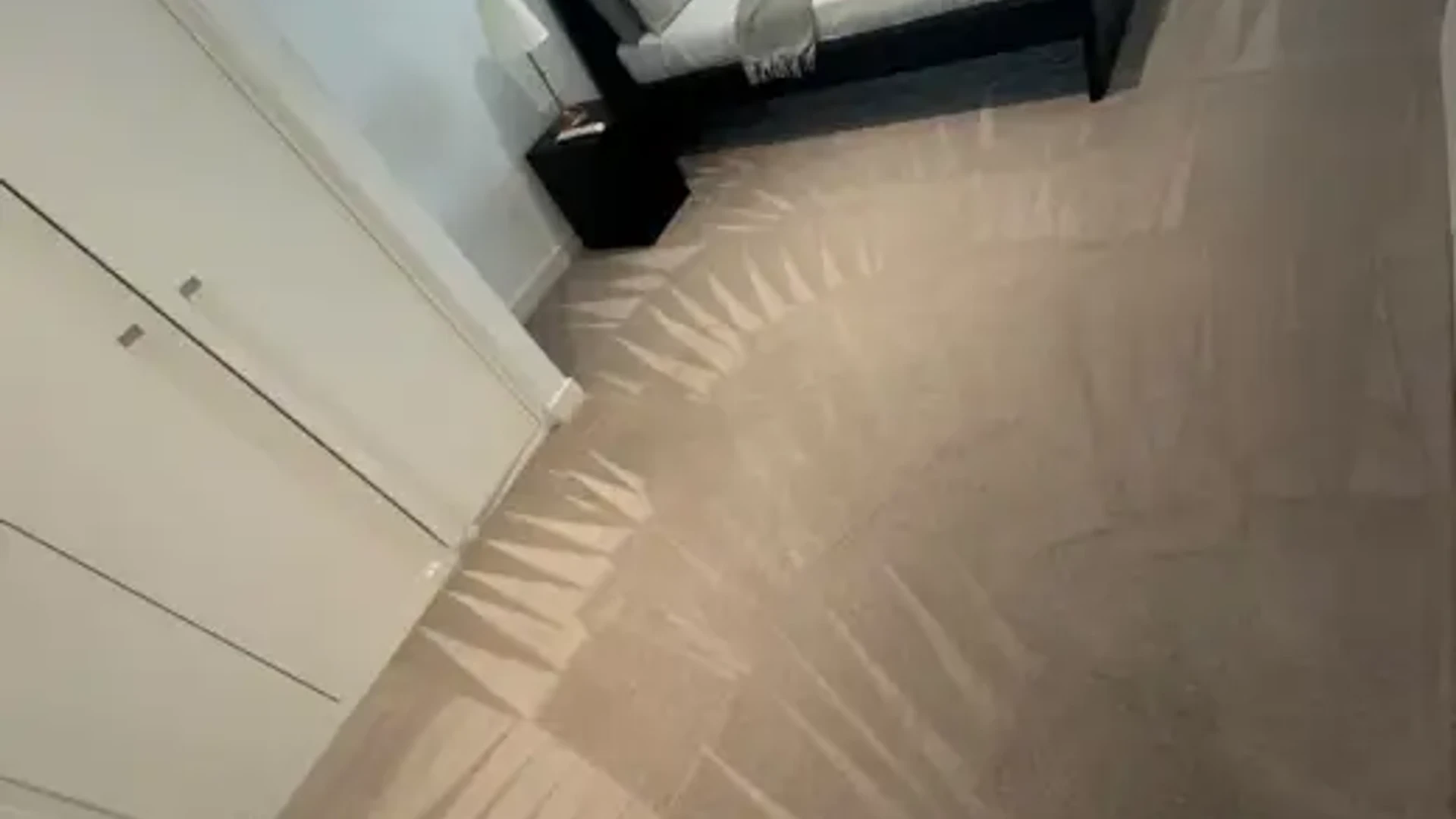 House deep cleaning technician wiping clean kitchen and bedroom surfaces
